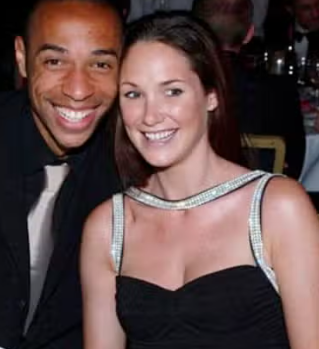 Footballer Thierry Henry and his wife Nicole Merry sit in front of